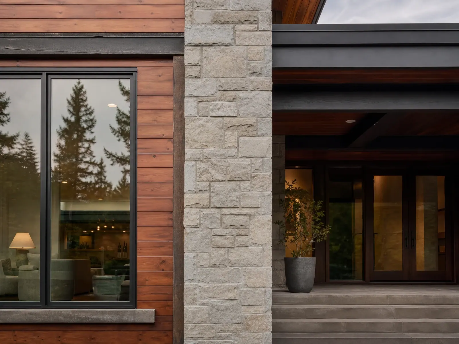 Detailed junction of windows, wood, masonry, and exterior cladding