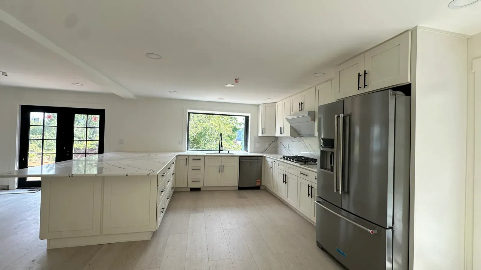Finished Redmond whole-home remodel showing connected kitchen and living space