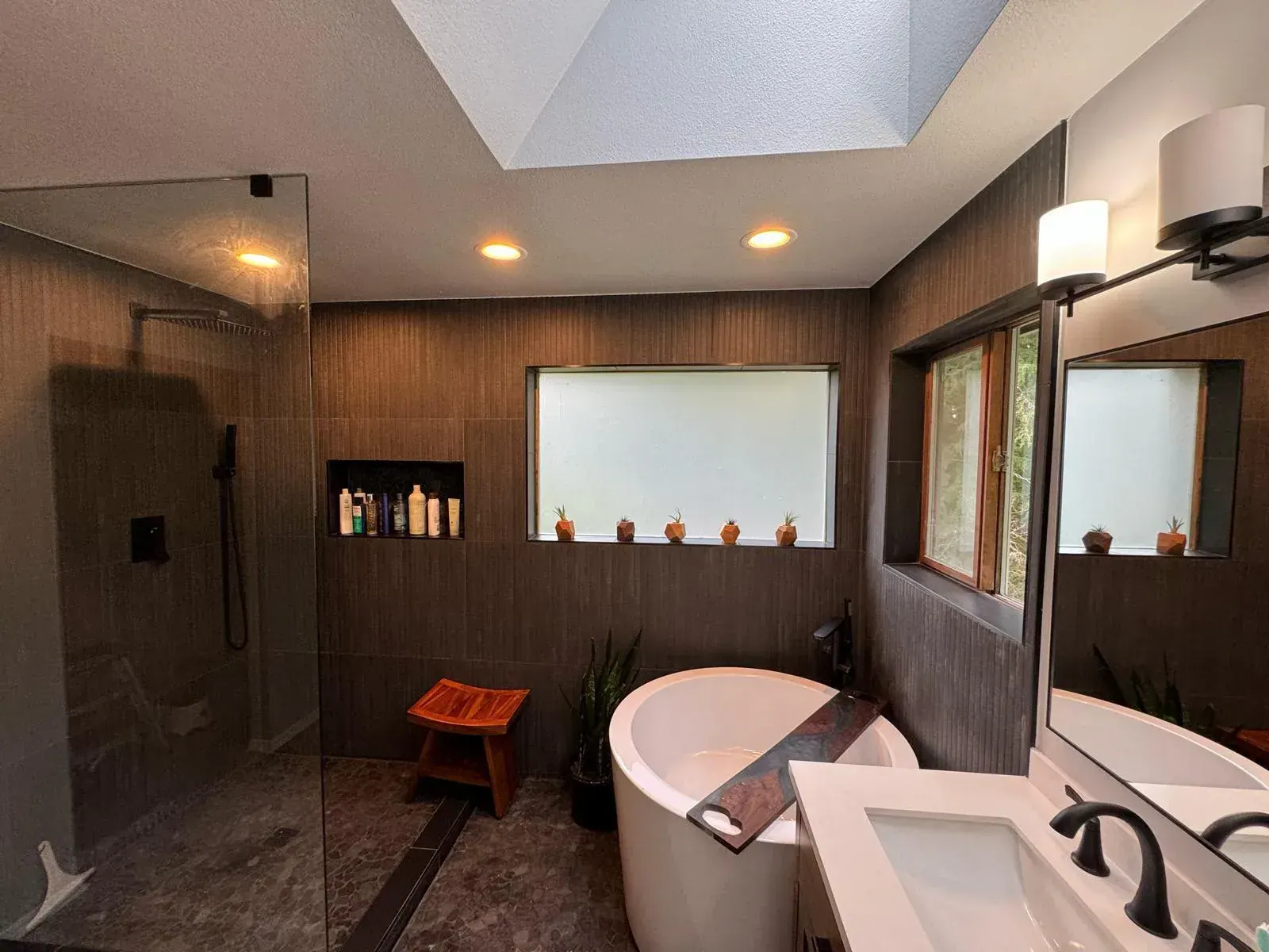 Finished Renton basement bathroom with a walk-in shower and clean tile detailing