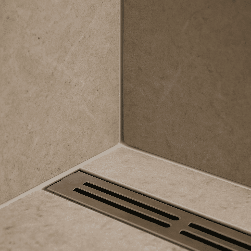 A tight craftsmanship detail of precise tile work and waterproofing joints communicates high installation standards with