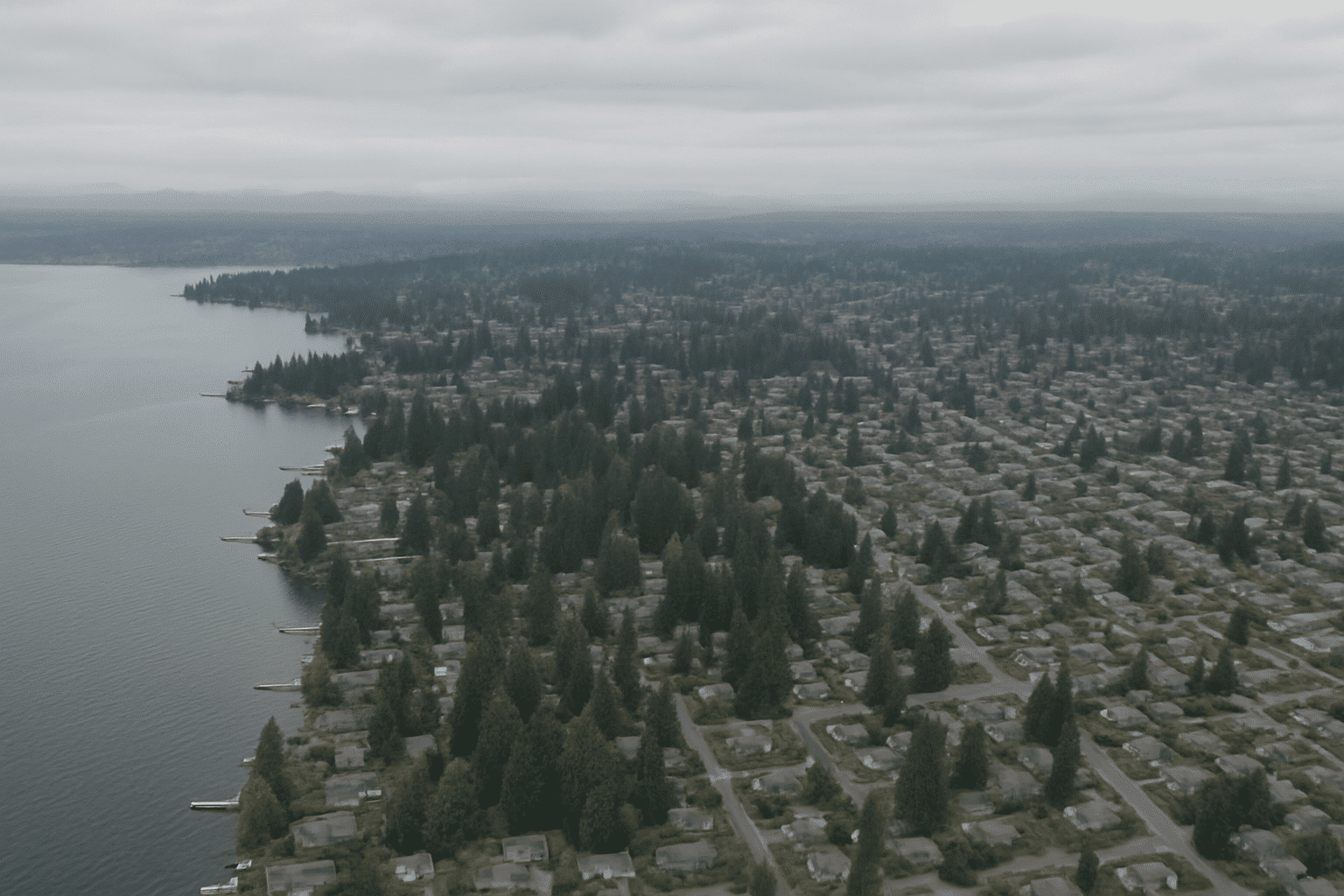 A real aerial view of the Greater Seattle Eastside geography anchors the service-area section to the actual region serve